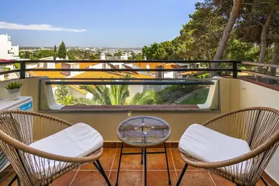 two chairs and a table on a balcony with a view at Garden Paradise, Old Town & Beach in Albufeira
