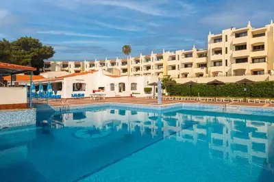 a large swimming pool in front of a hotel at Albufeira Jardim Sun Deck Studio in Albufeira