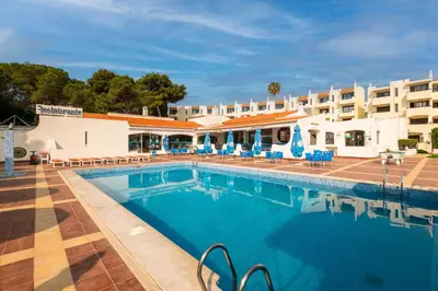a large swimming pool in front of a hotel at Albufeira Jardim Sun Deck Studio in Albufeira