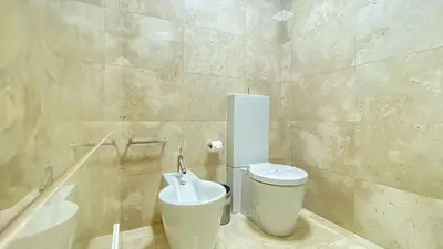a bathroom with a toilet and a sink at Que sonho! Vista Marina T2 HsR Vilamarina in Vilamoura