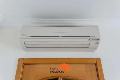 a air conditioner on the ceiling of a room at #166 Frat Apartment by Home Holidays in Albufeira