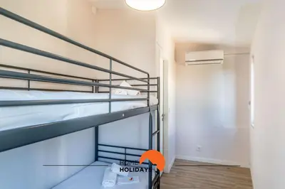 a small room with two bunk beds in it at #164 Saradel 42 by Home Holidays in Albufeira