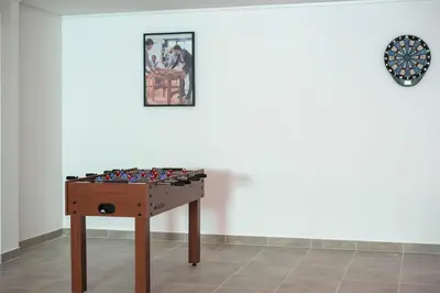 a chess board on a table in front of a wall at Villa Orada 25 by Stay ici Algarve Holiday Rental in Albufeira