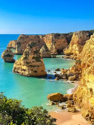 a view of a beach with rocks and the ocean at Outstanding Condo- Beach, Pool & Golf by BeCherish in Galé