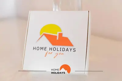 a sign for a home holidays for your homes at #165 Liberdade 105 by Home Holidays in Albufeira