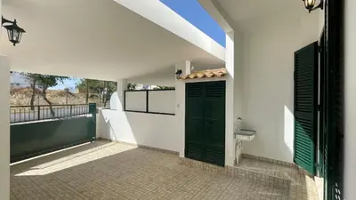 a bathroom with a green door and a toilet at Vale Pedras by Check-in Portugal in Albufeira