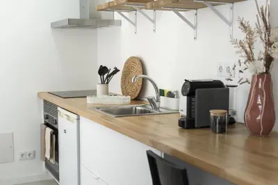 a kitchen with a sink and a counter top at Madalena Village 5 - City centre by HD PROPERTIES in Faro