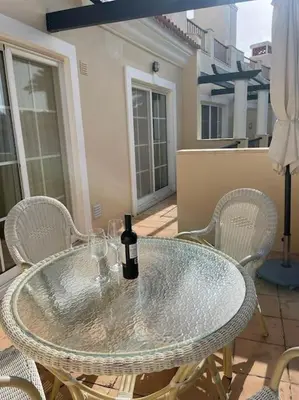 a bedroom with a white bed and a large window at 2 bed Apartment Palmyra Vila Sol in Quarteira