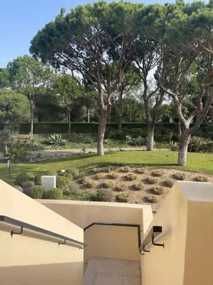 a bathroom with a sink and a toilet and a mirror at 2 bed Apartment Palmyra Vila Sol in Quarteira