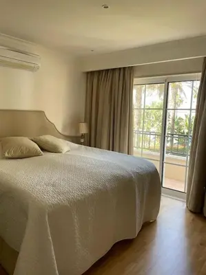 a living room with a couch and a table at 2 bed Apartment Palmyra Vila Sol in Quarteira