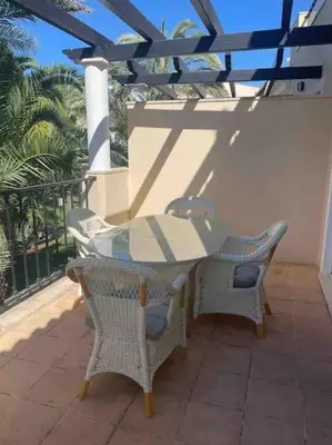 a park with palm trees and plants and a pathway at 2 bed Apartment Palmyra Vila Sol in Quarteira