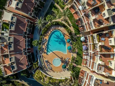 an overhead view of a swimming pool in a city at 5 star Luxury Palmview apartment with large terrace and communal pool in Quarteira