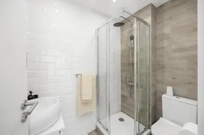 a bathroom with a shower and a toilet and a sink at Silver Lux Studio 1 - City Center by HD PROPERTIES in Vilamoura