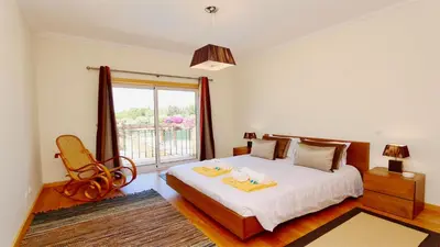 a bedroom with a bed with two towels on it at Villa Nuki- CleverDetails, quiet location, sleeps 8, private pool in Vilamoura