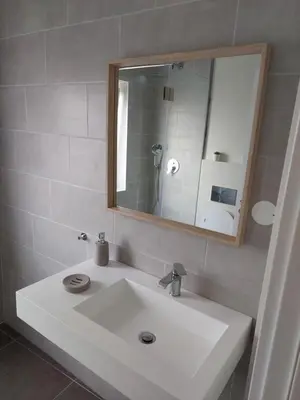 a bathroom with a white sink and a mirror at Impervila 201 in Vilamoura