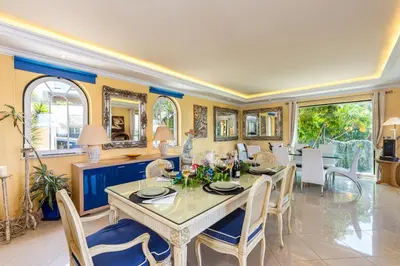 a dining room with a table and chairs at Villa Casa do Monte in Albufeira