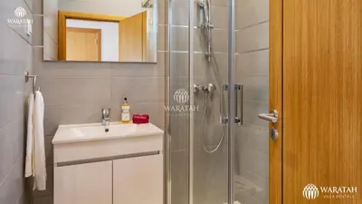 a bathroom with a shower and a sink at Townhouse Farah in Vale do Lobo
