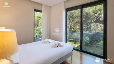 a bedroom with a bed and a large window at Apartment Micaela in Vale do Lobo