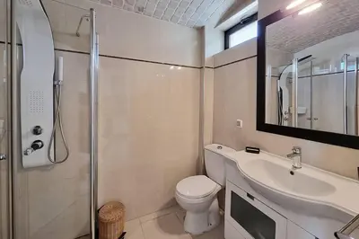 a bathroom with a toilet and a sink and a shower at Blue Sea in Albufeira