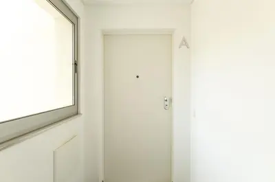 a door with a letter on it next to a window at Glamour Apartment With Pool in Albufeira