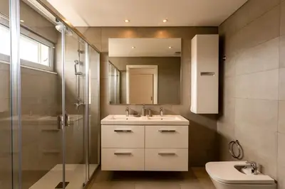 a bathroom with a sink and a toilet and a mirror at Glamour Apartment With Pool in Albufeira