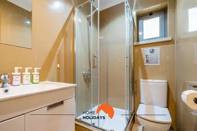 a bathroom with a shower and a toilet and a sink at #160 V3 Vila Branca 92 by Home Holidays in Albufeira