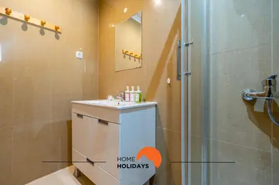 a bathroom with a shower and a sink and a toilet at #160 V3 Vila Branca 92 by Home Holidays in Albufeira