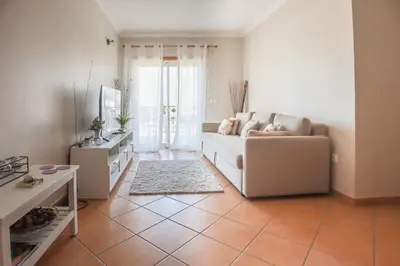 a living room with a couch and a table at Apart ALGARVE - Piscina - BY BEDZY in Albufeira