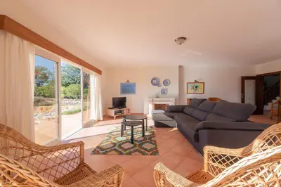 a living room with a couch and a table at Villa Agua by Gabi Miguel in Albufeira