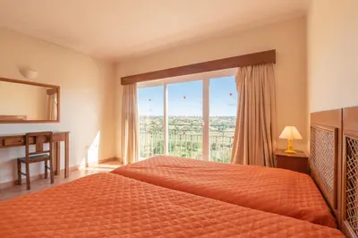 a bedroom with a bed and a large window at Villa Agua by Gabi Miguel in Albufeira