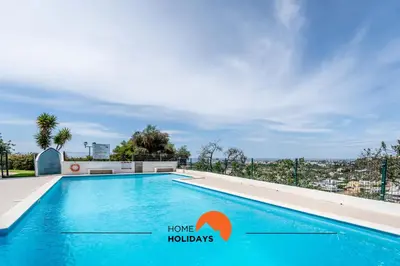 a swimming pool on the roof of a house at #158 T3 Panorama C by Home Holidays in Albufeira