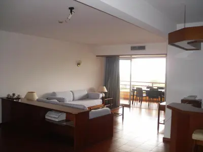 a living room with a couch and a table at Aparthotel Dom Pedro Portobelo in Vilamoura