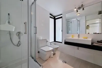 a bathroom with a toilet and a sink and a shower at Paradise full océan in Albufeira