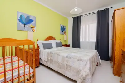 a bedroom with a bed and a window at Galé Catia by Innkeeper in Guia