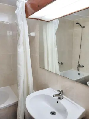 a bathroom with a sink and a mirror at Bright apartment with sea view in Albufeira - 67 m² + pool in Albufeira