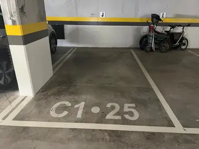 a parking lot with a bike parked in a garage at Gardens Dubai by FHR in Vilamoura