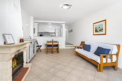 a living room with a couch and a fireplace at Casa Solar in Guia