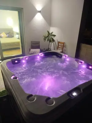 a jacuzzi tub with lights in a room at Villa Luz 37 - Jacuzzi Terrace & Swimming Pool in Albufeira