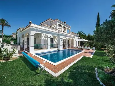 a large house with a swimming pool in the yard at Exquisite Quinta Da Lago Villa Villa Majestic Heights 4 Bedrooms in Almancil