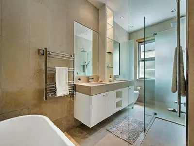 a bathroom with a tub and a sink and a shower at Exquisite Quinta Da Lago Villa Villa Majestic Heights 4 Bedrooms in Almancil