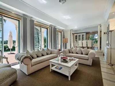 a living room with two couches and a table at Exquisite Quinta Da Lago Villa Villa Majestic Heights 4 Bedrooms in Almancil