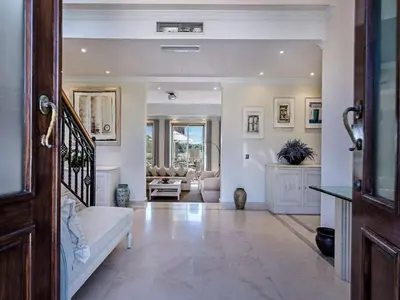 a large living room with a staircase and a living room at Exquisite Quinta Da Lago Villa Villa Majestic Heights 4 Bedrooms in Almancil