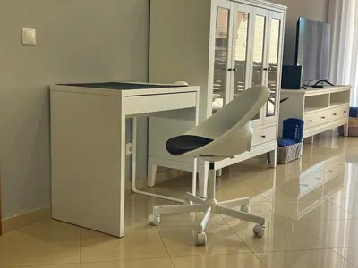 a white desk with a white chair and a computer at Millennium golf by FHR piscina & parking in Vilamoura