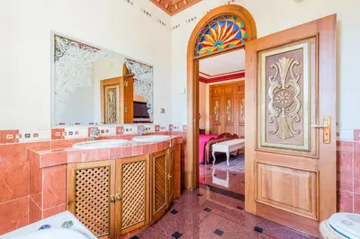 a bathroom with two sinks and a large mirror at Quinta do Galvao - Luxury Villa by HD PROPERTIES in Quarteira
