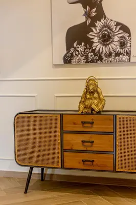 a gold lion sitting on top of a dresser at Guest House Jacarandá Faro in Faro
