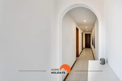 a hallway with an archway in a house at #169 T3 Medronheira by Home Holidays in Albufeira