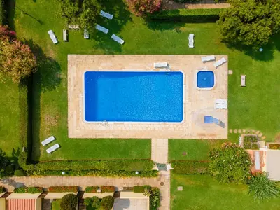 an overhead view of a swimming pool in a yard at Mourabel Apartment - S by HelloVacations in Loulé