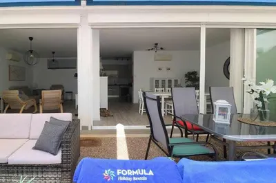 a kitchen with a refrigerator and a washing machine at Anzol By FHR in Quarteira