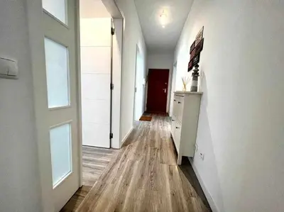 a white bedroom with a bed and a window at Anzol By FHR in Quarteira
