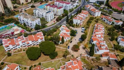 an aerial view of a city with buildings and trees at 1 BDR Vilamoura Escape W Patio by LovelyStay in Quarteira